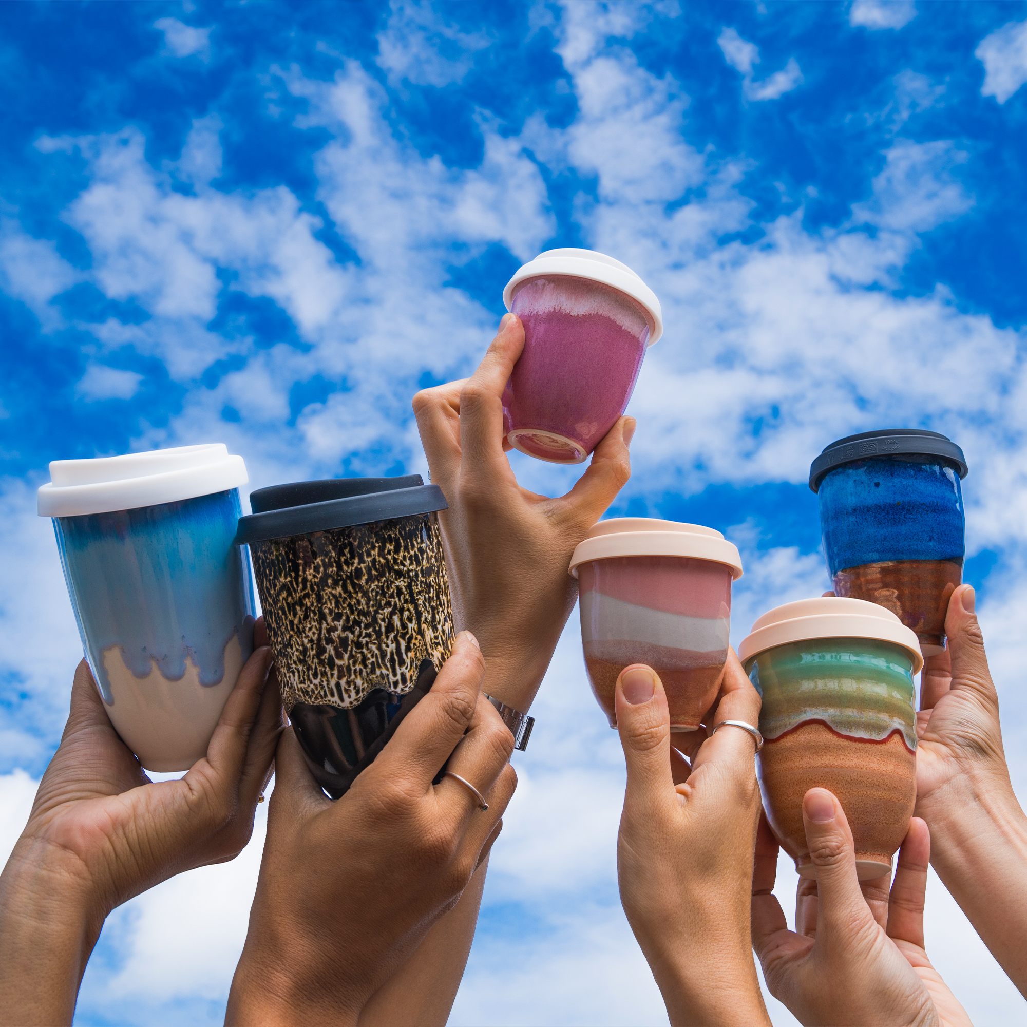 Collection of Travel Cups in a variety of sizes and glazes