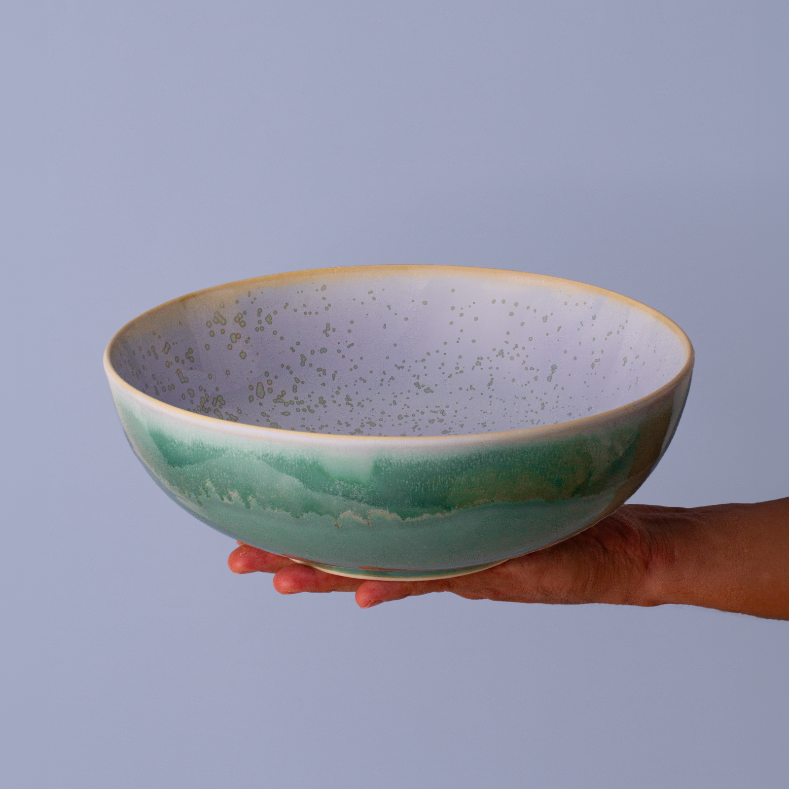 Potter For The Planet Salad Bowl Ocean Jasper in hand