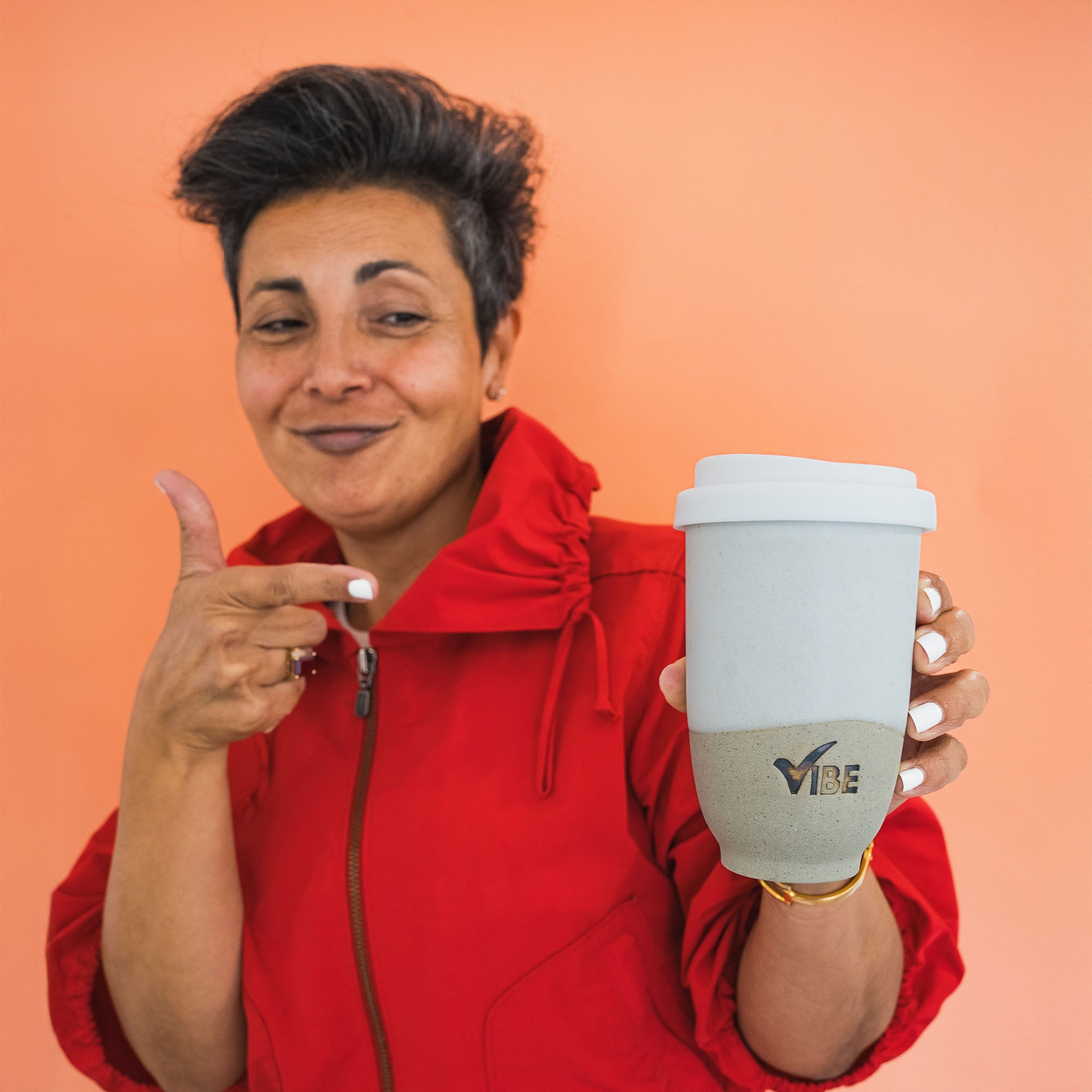 Moodshot holding sandy vibe cup