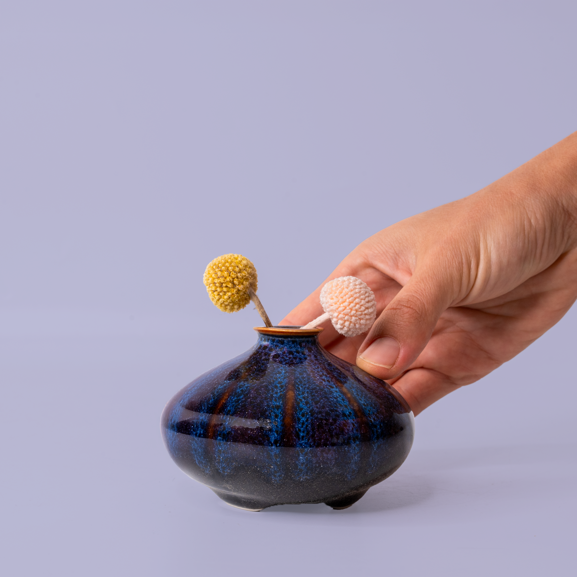 Small dark blue ceramic vase with textured finish by Pottery For The Planet artisan decorative vases