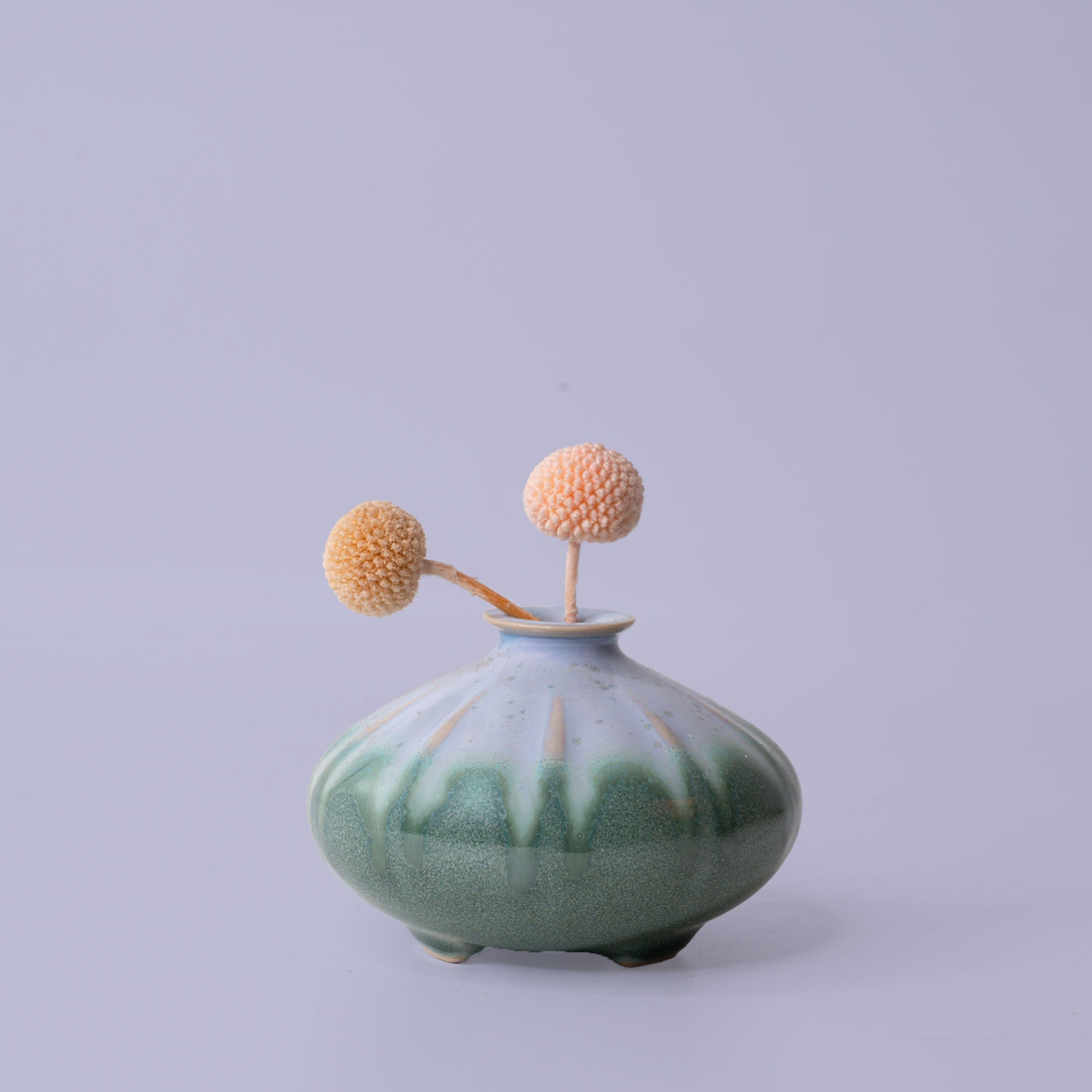 Pottery For The Planet artisan decorative vases in green and blue with round shape and dried flowers