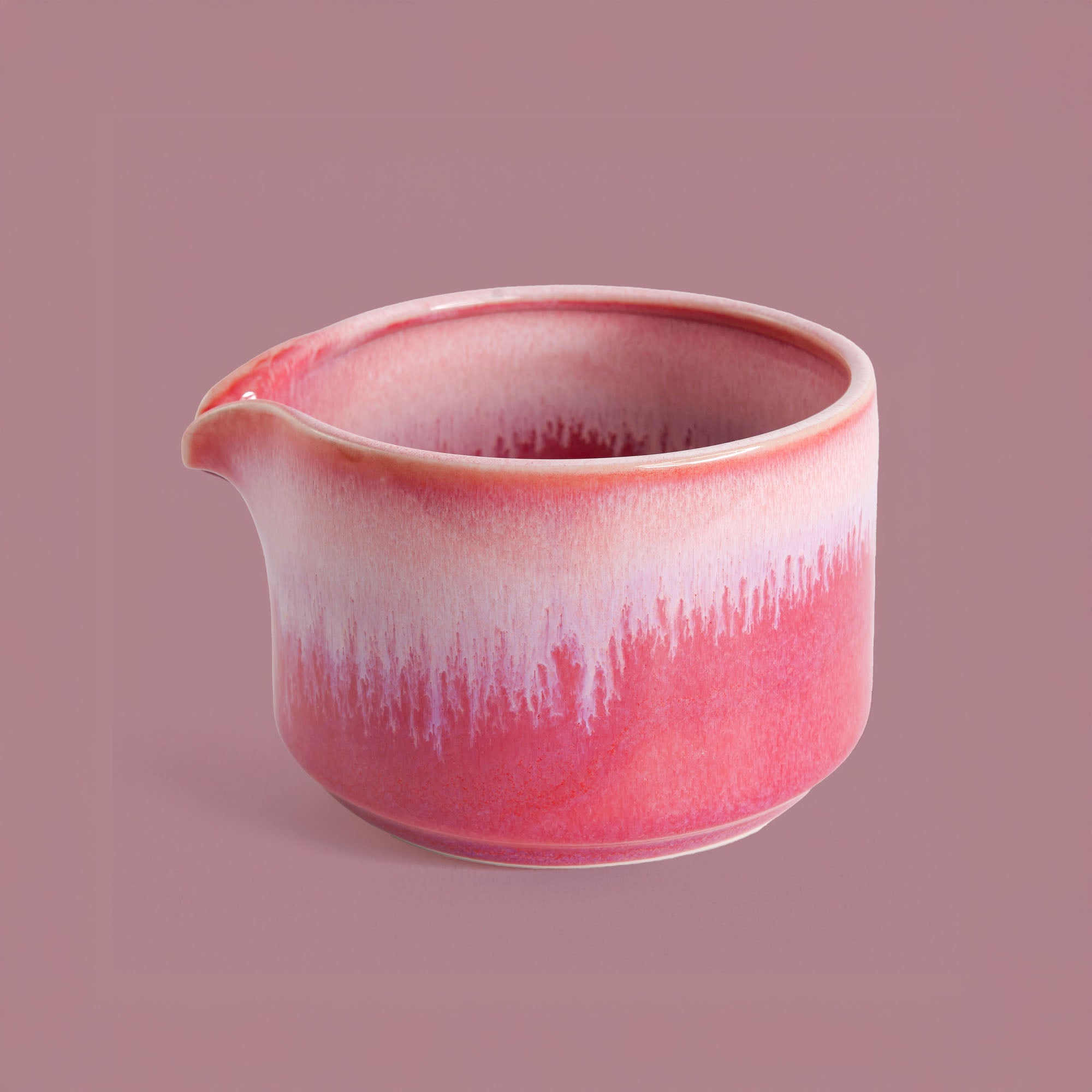 Handcrafted matcha bowl by Pottery For The Planet in pink and white glaze with pouring spout