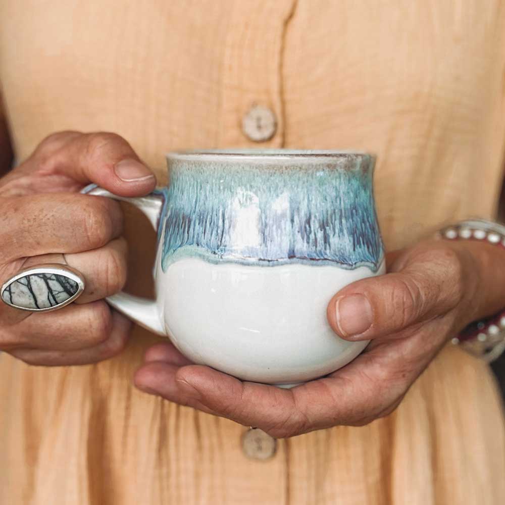 Blue and purple mug in hand