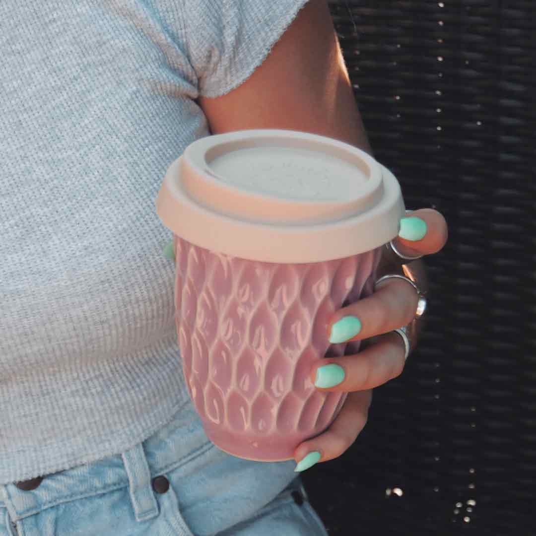 Lavender Travel Cup Held In Girls Hand