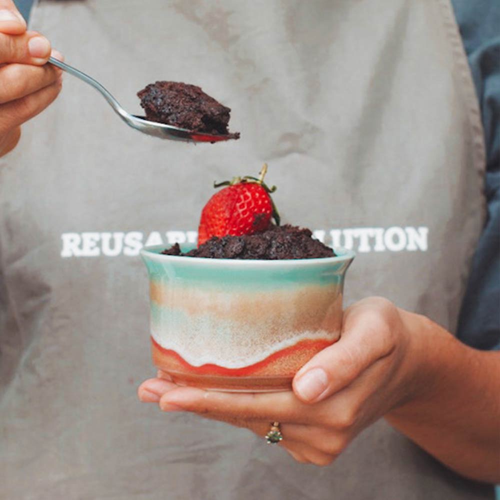 ramekin with strawberry and spoon