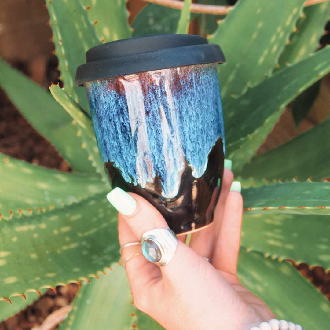 Pottery For The Planet Cup Crystal Cascades Held Next to Aloe Vera