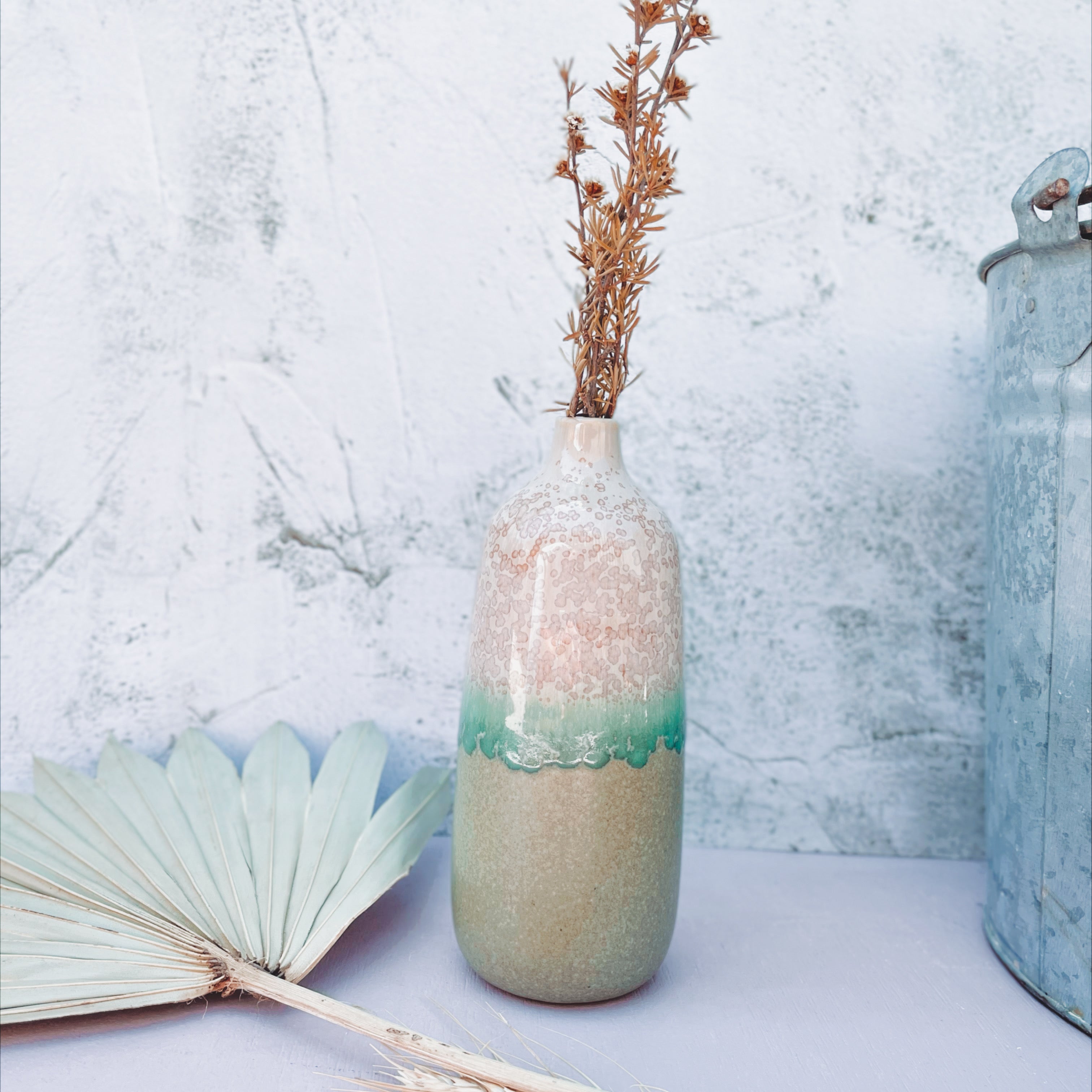 Pottery For The Planet eco-friendly home decor vase with natural earthy tones and dried floral arrangement