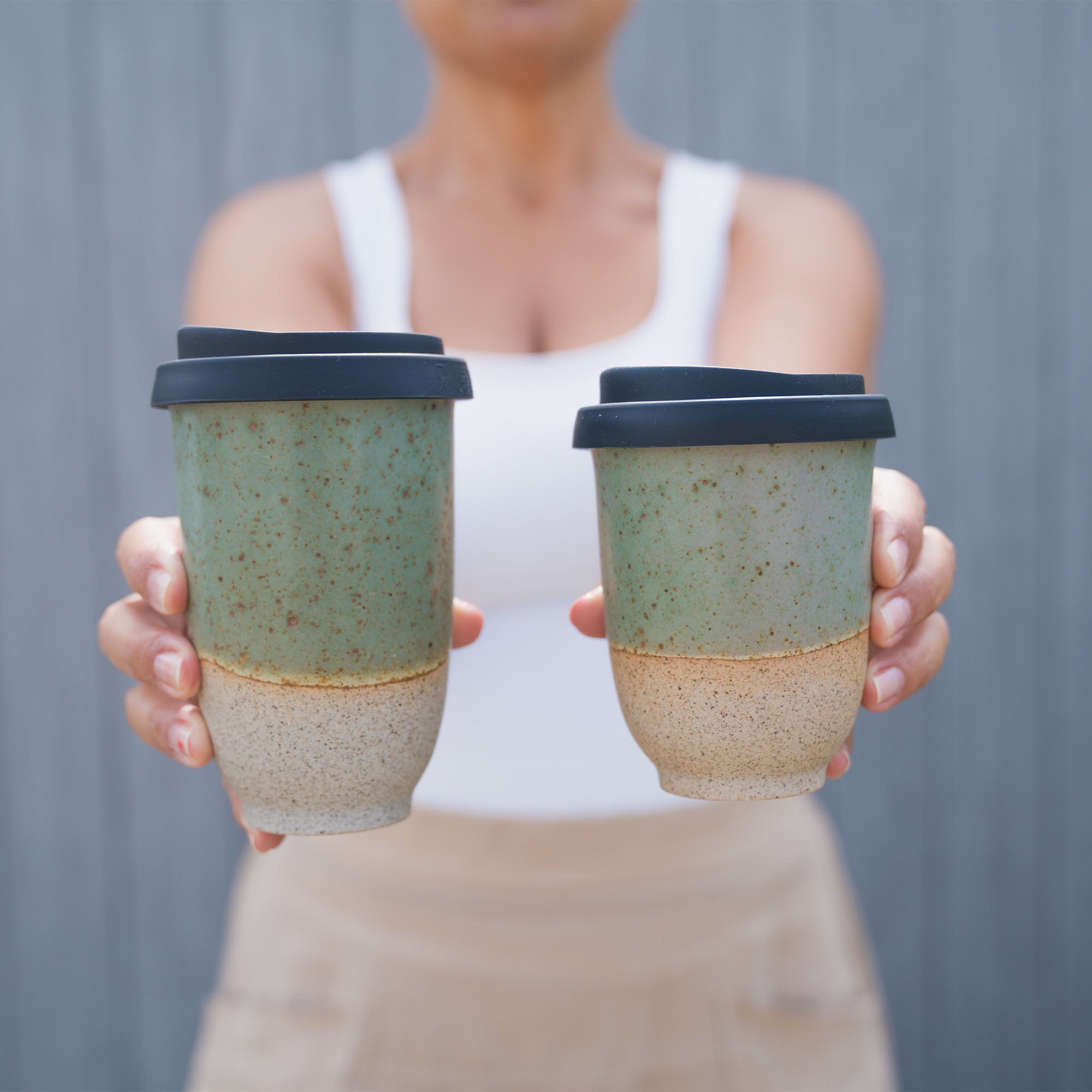 Moodshot of 2 forest moss travel cups in different sizes