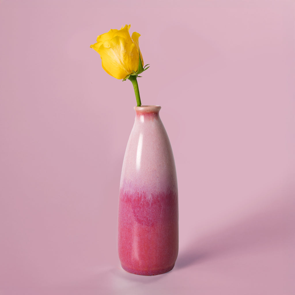 Pottery For The Planet artisan decorative vase for flowers with pink gradient glaze holding a yellow rose