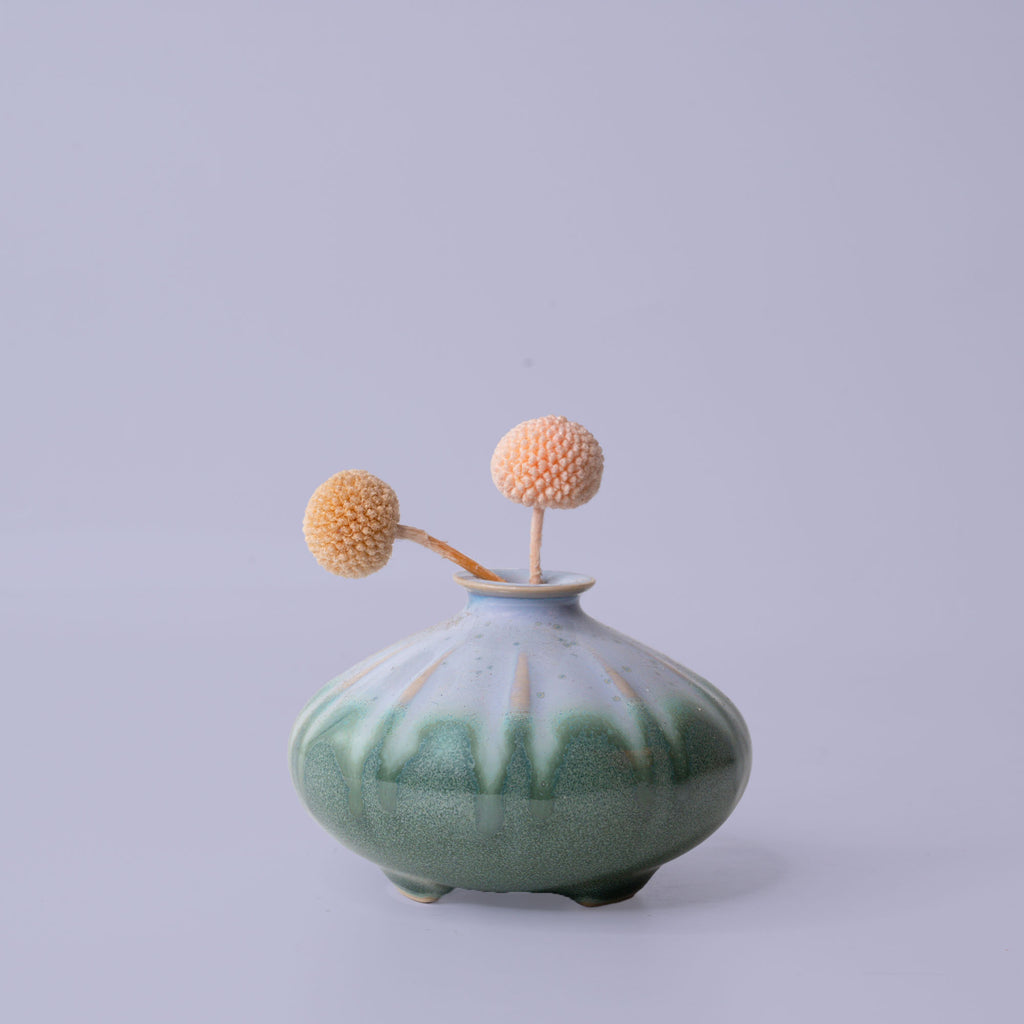 Pottery For The Planet artisan decorative vases in green and blue with round shape and dried flowers