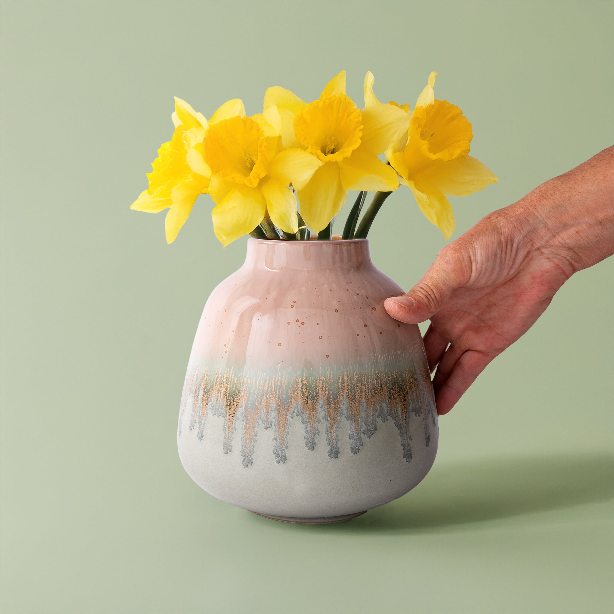 Pottery For The Planet ceramic bouquet vase for home decor with pink and gray glaze holding yellow daffodils