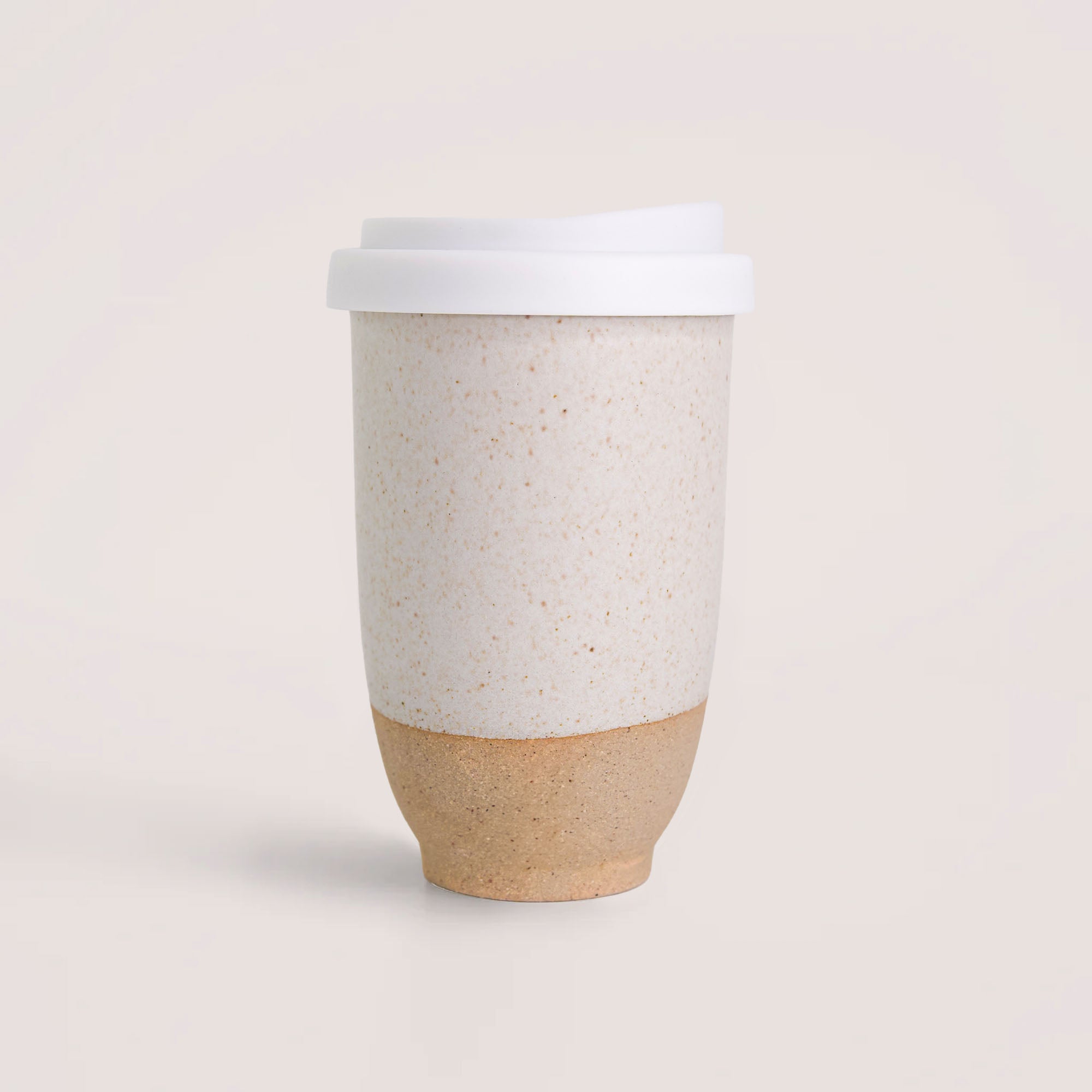 Pottery For The Planet handmade reusable coffee cup with white lid and speckled ceramic body