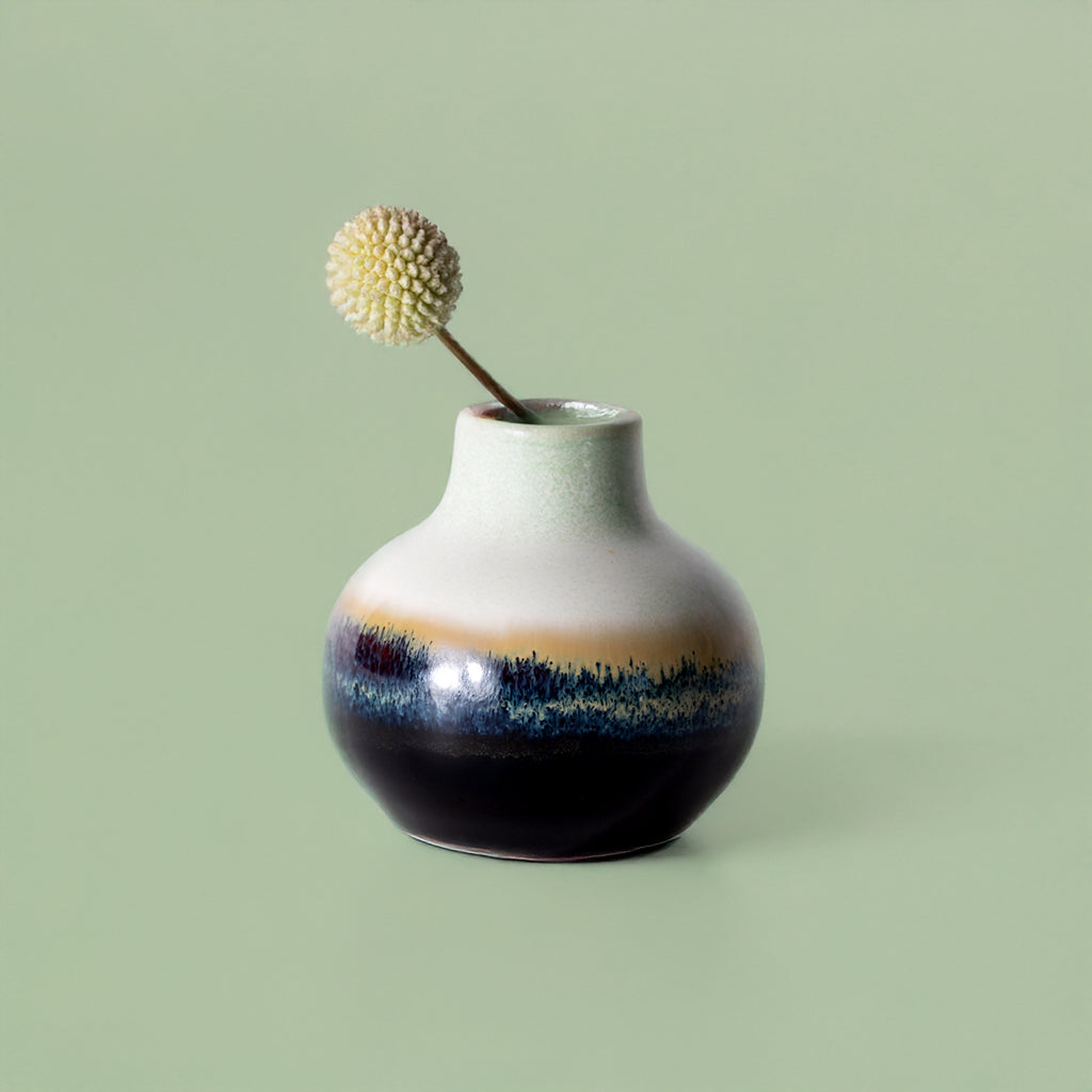 Pottery For The Planet small handmade home decor vase with gradient blue and white finish holding dried flower