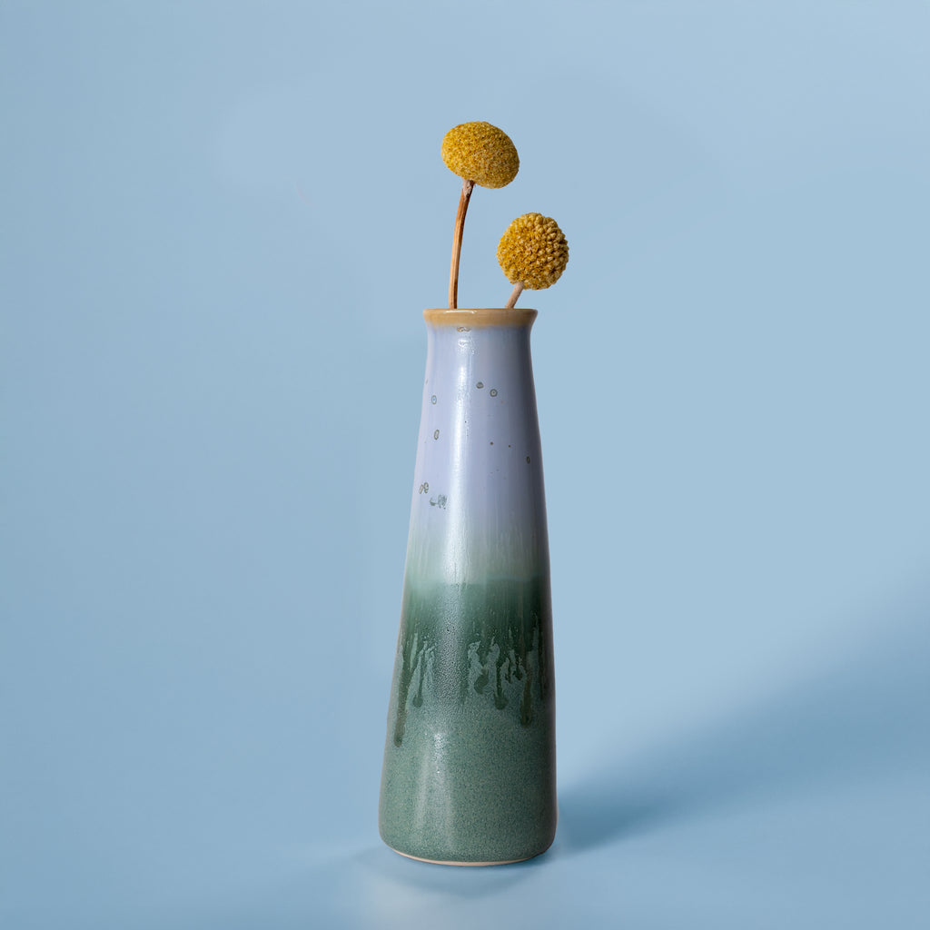 Tall green and white ceramic sustainable home decor vase with dried yellow flowers