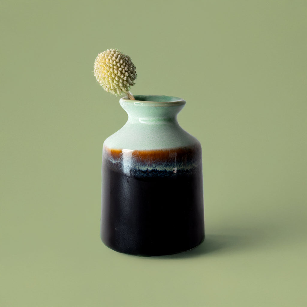 Miniature decorative vase for shelf by Pottery For The Planet with a green and black glaze finish