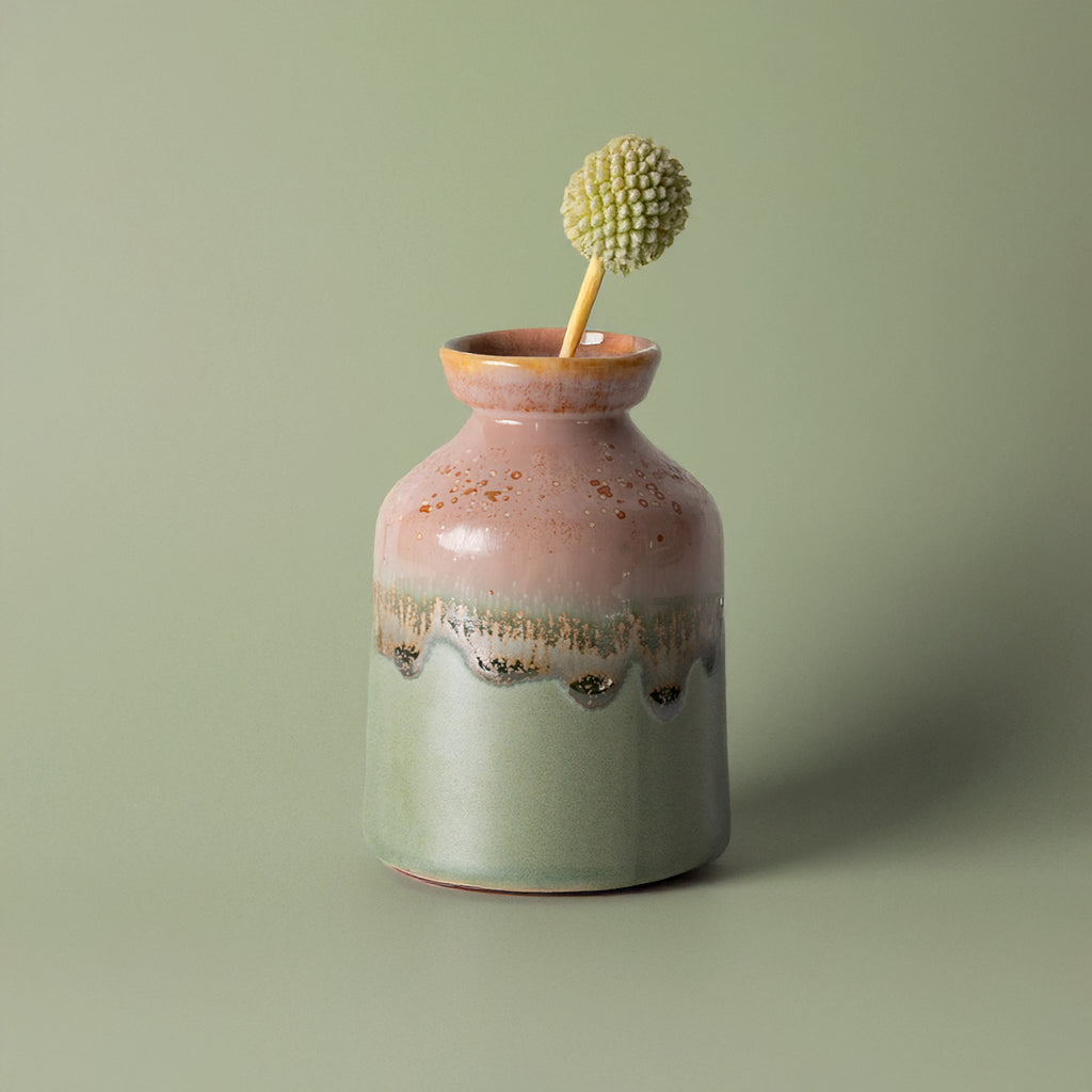 Pottery For The Planet miniature decorative vase for shelf with pink and green glaze holding a single dried flower