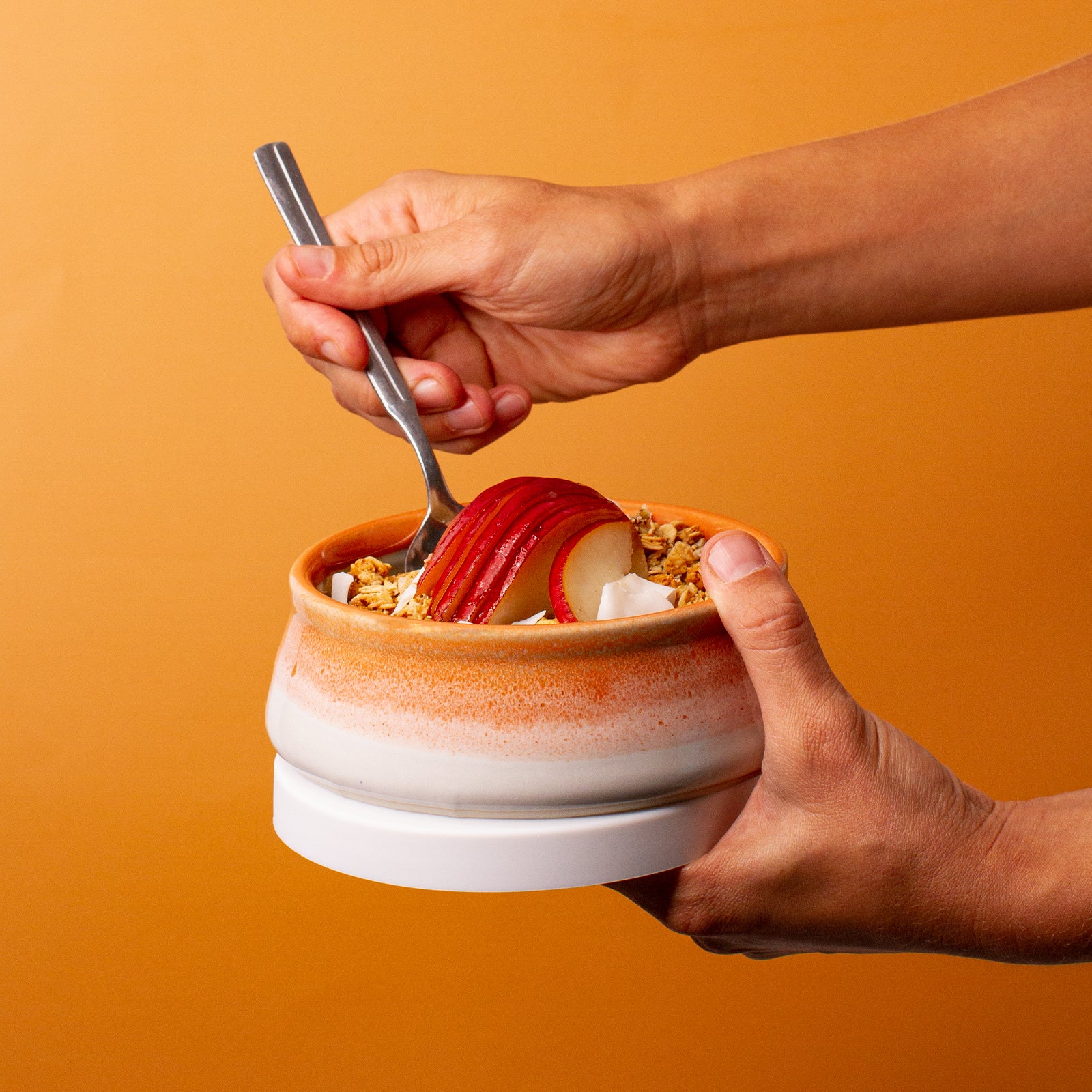 orange and white ceramic bowl