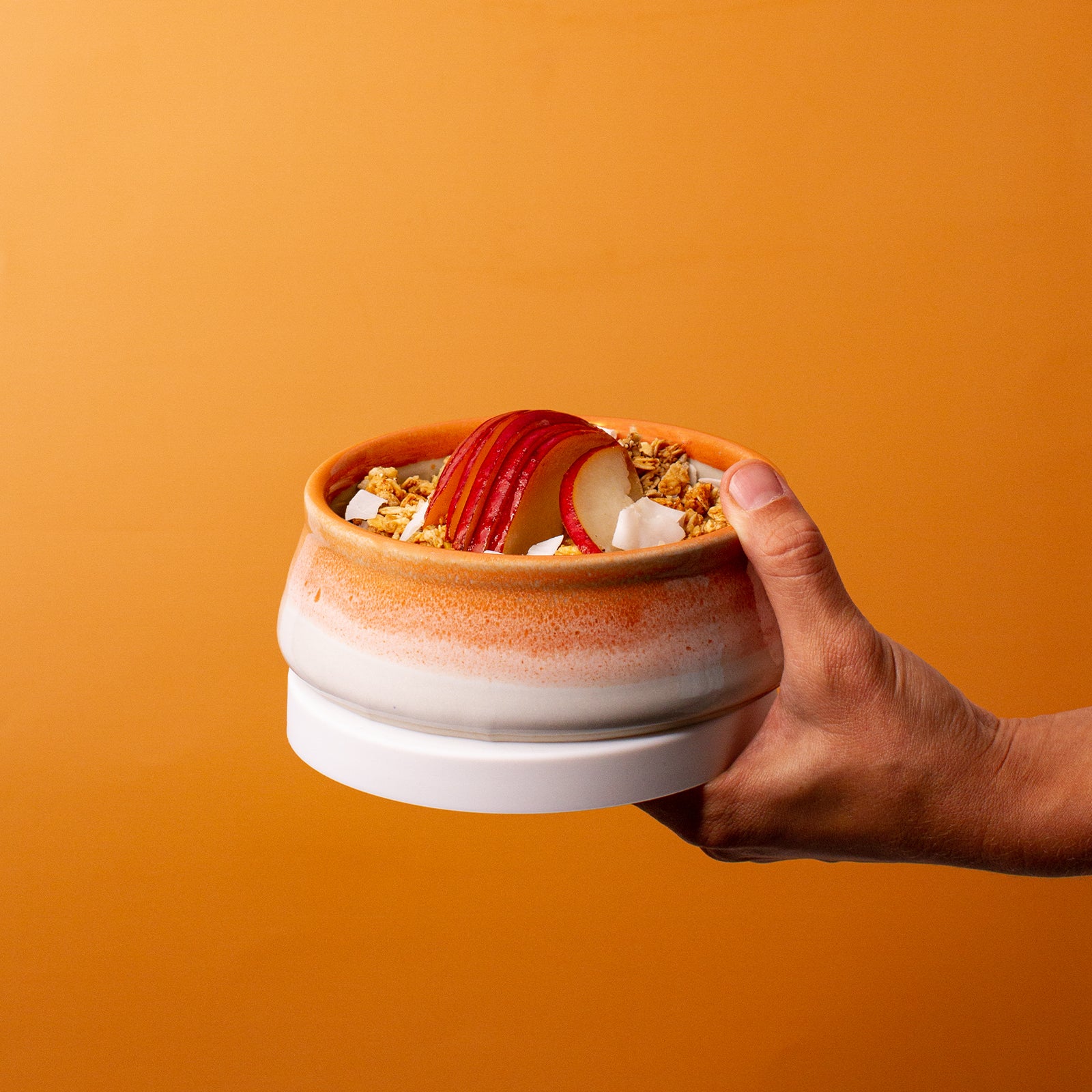 orange and white ceramic bowl