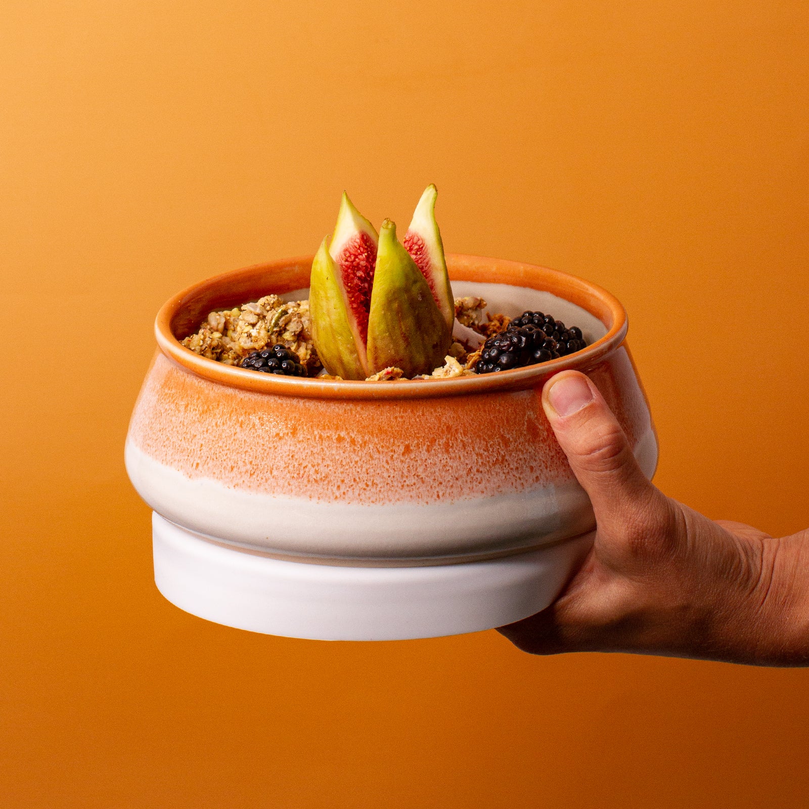 orange and white ceramic bowl