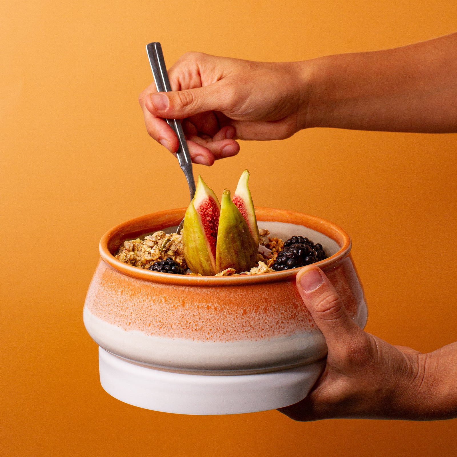 orange and white ceramic bowl
