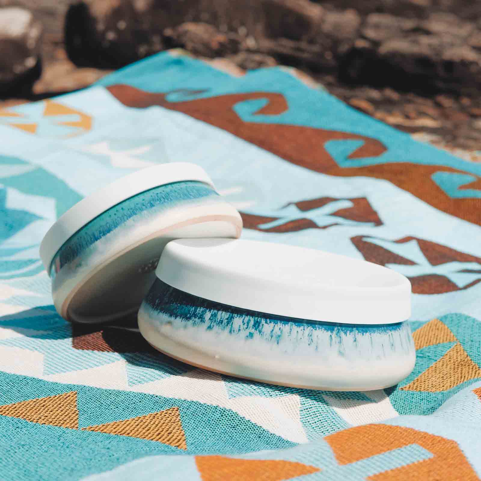 Ocean Blue lunch container on beach rug