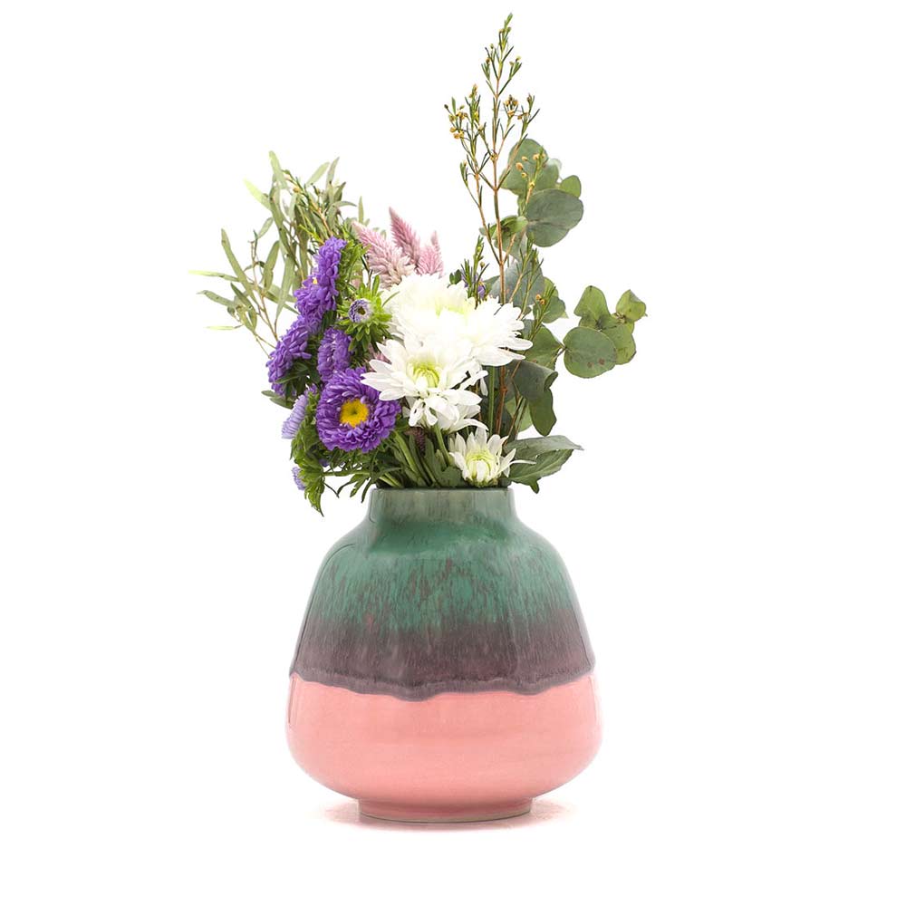 Pottery For The Planet bouquet vase for home decor with green and pink glaze holding mixed flowers