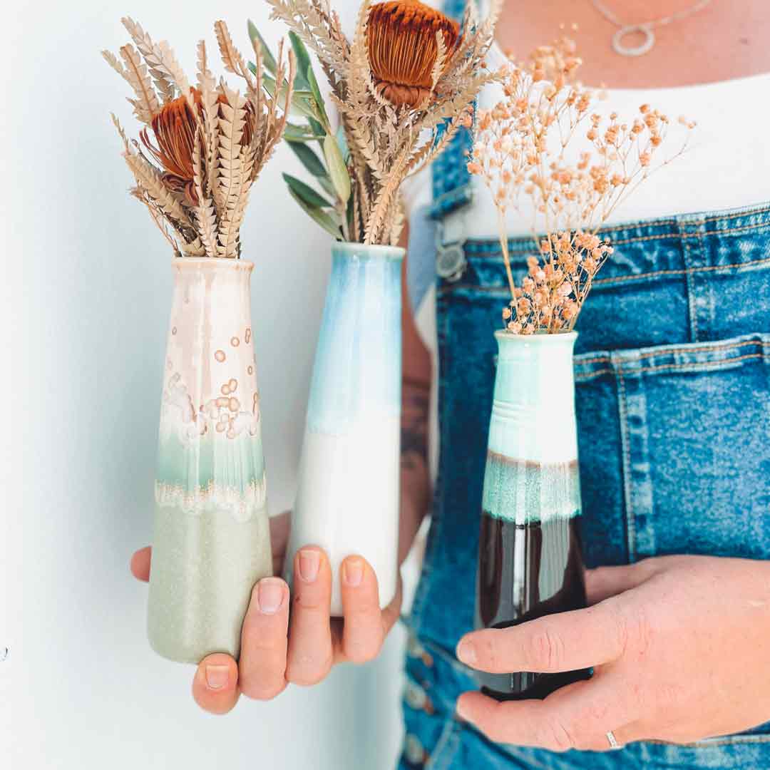 Poppy Ceramic Vase Being Held By Woman in Rainforest Jasper, Monsoon, And Sexy Lime